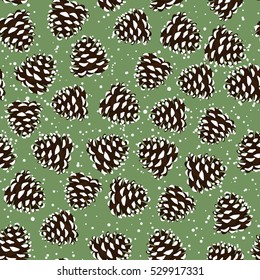 Seamless background of spruce cones in the snow. Pattern.