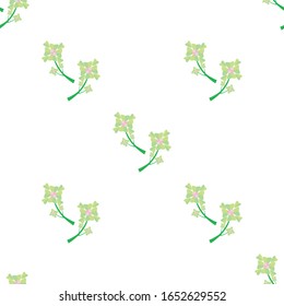 Seamless background texture with green shamrock leaves.