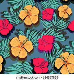 Seamless background with tropical flowers and leaves