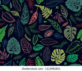 Seamless background with tropical leaves. Bright jungle pattern with leaves and exotic plant. The elegant template with Hawaiian motifs, on dark blue background.