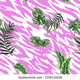 Seamless background with tropical leaves and skin of the tiger.