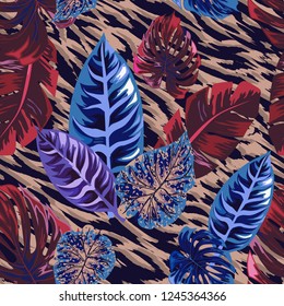 Seamless background with tropical leaves and tiger stripes