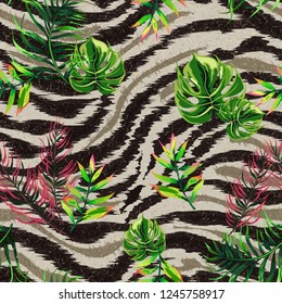 Seamless background with tropical leaves and tiger stripes