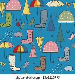 seamless background of umbrellas and boots, rain and spring birds - hand-drawn objects on the theme April Showers