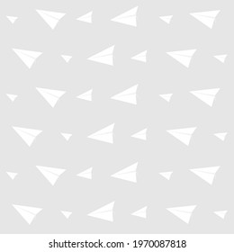 Seamless background vector illustration of paper rocket in white on gray background