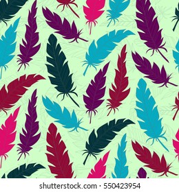 Seamless background vintage colored feathers. Pattern.