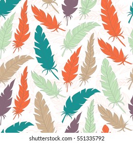 Seamless background vintage colored feathers. Pattern.
