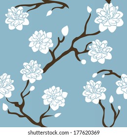 Seamless background of white delicate flowers on the branches