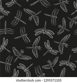 Seamless background of white dragonfly images on black background
