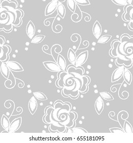 Seamless background. White embroidery on a grey background. Sewing. Textile rapport.
