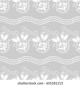 Seamless background. White embroidery on a grey background. Sewing. Textile rapport.
