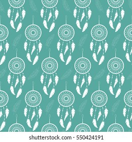 Seamless background of white feathers and dream catchers on a colored background. Pattern.