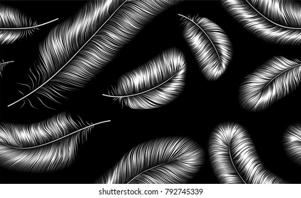 Seamless background with white feathers on black, isolated