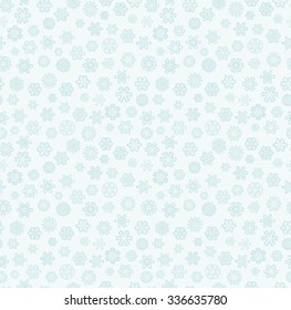 seamless background with white snow flakes on blue