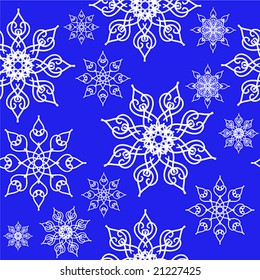 Seamless background with white snowflakes