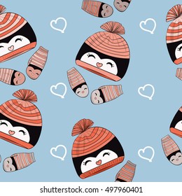 A seamless background. Winter hat and mittens. With a cute penguin pattern.