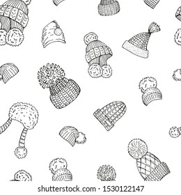 Seamless background with winter hats. Endless pattern with different caps. Hand drawn, sketches.