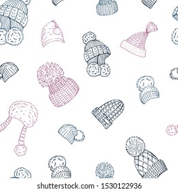 Seamless background with winter hats. Endless pattern with different caps. Hand drawn, sketches.