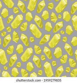 Seamless background. Yellow crystals of various shapes. Shining crystals isolated on a gray background. 