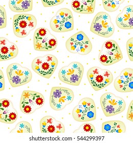 Seamless background of yellow hearts
