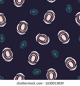 Seamless beautiful modern abstract pattern with light pink and green circles of different sizes on a dark blue background. Can be used for printing on fabrics, clothes, paper, packaging, bedding.