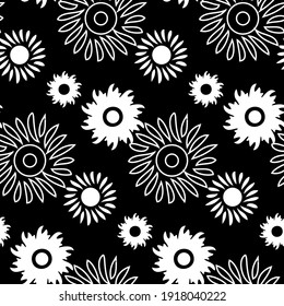 Seamless beautiful pattern with a pattern of leaves and flowers on a black background