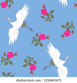 Seamless beautiful vector illustration with cranes and roses on a blue background. For decorating textiles, packaging and wallpaper.
