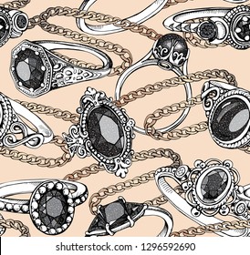 Seamless beauty pattern. Silver Finger Rings with black gems and gold necklaces on a beige background. Textile composition, hand drawn style print. Vector illustration.