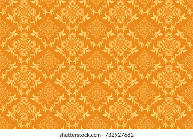Seamless beige floral ornament on a yellow background. Wallpaper pattern