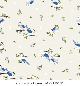 Seamless bird pattern. Repeating vector print with blue and white birds sitting on tree branches, green leaves and small flowers on a cream coloured background. Apparel textile pattern.