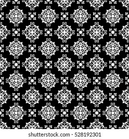 Seamless black background with white pattern in baroque style.