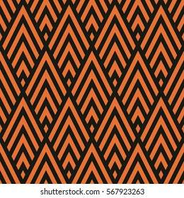 Seamless black and bronze orange rhombic chevrons art deco pattern vector