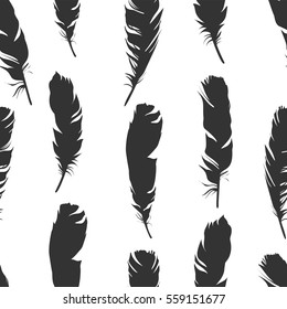 Seamless black illustration with feathers on a white background. Natural vector pattern. Boho style. Simple silhouettes.