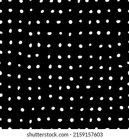 Seamless black polka dot print. Dotted vector pattern. Abstract minimalistic background.