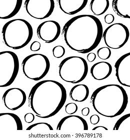 The seamless black and white abstract brush stoke pattern. The creative monochrome hand drawn background with circles for your design. Textile, blog decoration, banner, poster, wrapping paper.