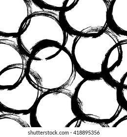 The seamless black and white abstract brush stoke pattern. The creative monochrome hand drawn background with circles for your design. Textile, blog decoration, banner, poster, wrapping paper.