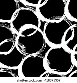 The seamless black and white abstract brush stoke pattern. The creative monochrome hand drawn background with circles for your design. Textile, blog decoration, banner, poster, wrapping paper.