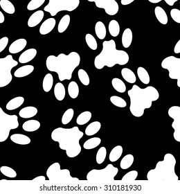 Seamless black and white background with cat tracks for creating card, web page background, wallpaper and textile.