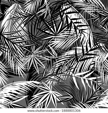 Seamless black and white background with coconut and fan palm leaves. Tropical leaf print for fashion textile and wallpaper