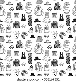 Seamless black and white background with hand drawn fashion clothes.