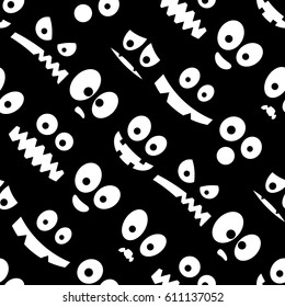 Seamless black and white faces pattern.