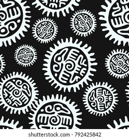 Seamless black and white fashion backdrop pattern with aztec and mayan eagle and a sun-shaped circle on dark background