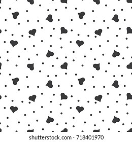 Seamless black and white hearts and dots pattern vector