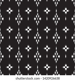 seamless black and white  ikat and tribal pattern on black