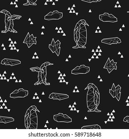 Seamless black and white kids tribal vector pattern with penguins and triangles.