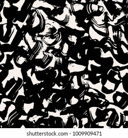 The seamless black and white pattern with abstract brush stokes. The creative monochrome hand drawn background for your design. Textile, blog decoration, banner, poster, wrapping paper.