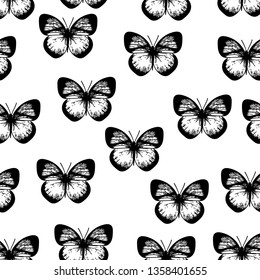 Seamless black and white pattern of butterflies on white background.