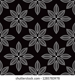 Seamless black and white pattern of dotted flowers with tracery petals. Floral trellis. Mosaic monochrome print. Vector Illustration.