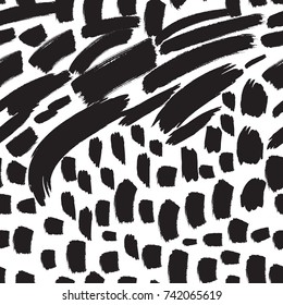Seamless black and white pattern hand drawn with a brush. Abstract brushstrokes.