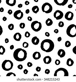The seamless black and white pattern with polka dots. The creative monochrome hand drawn background for your design. Textile, blog decoration, banner, poster, wrapping paper.